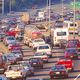 Traffic moves slowly near Seatte, WA, where a majority of drivers say they support other people using mass transit.